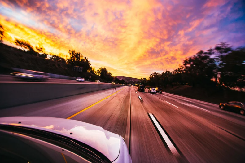 car-driving-down-freeway.png